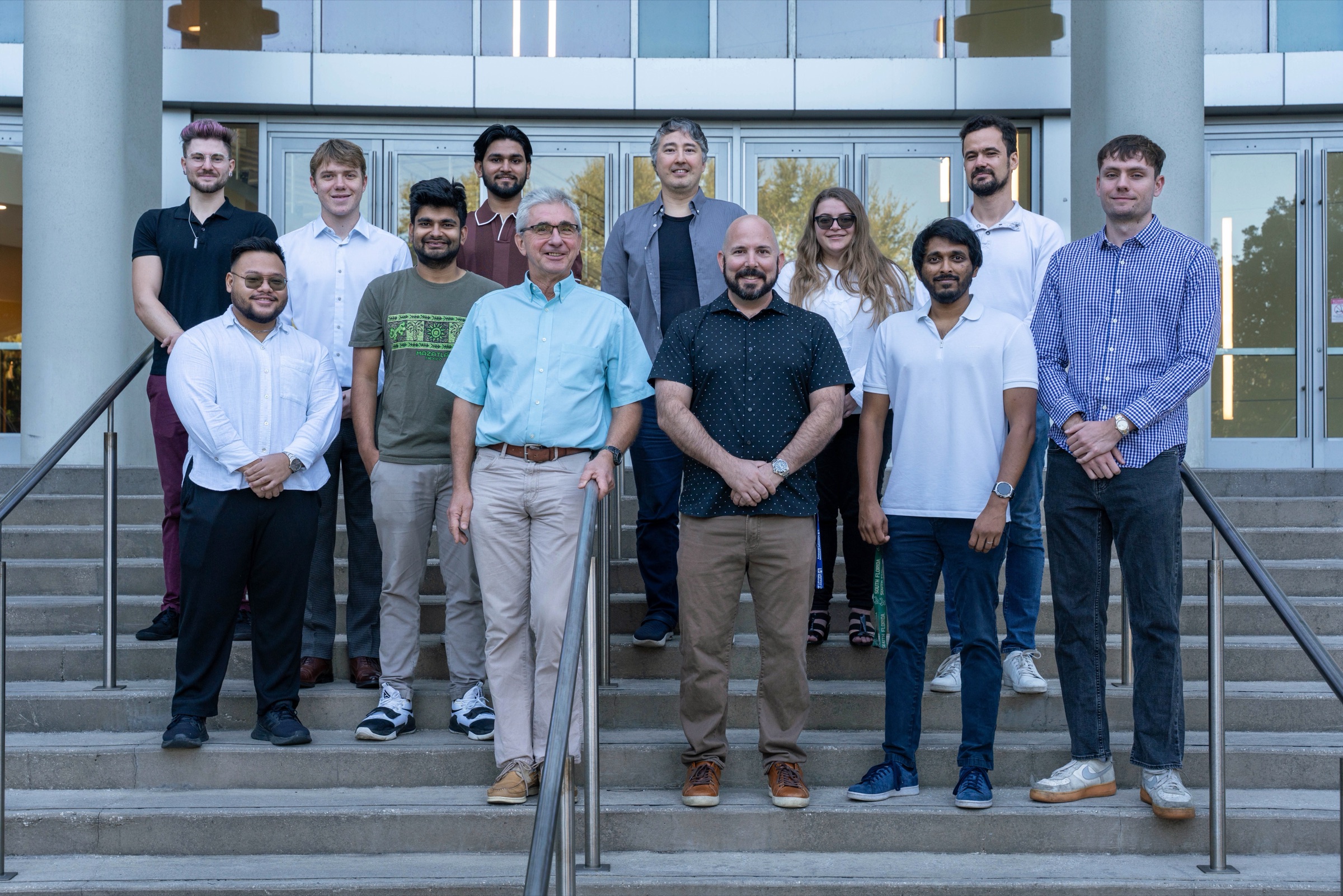Members of the Materials Simulation Laboratory on the steps of the ISA building